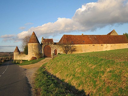 Cycle ride in Bellou-sur-Huisne on the Véloscénie route - La Moussetière Pepperpot turrets.