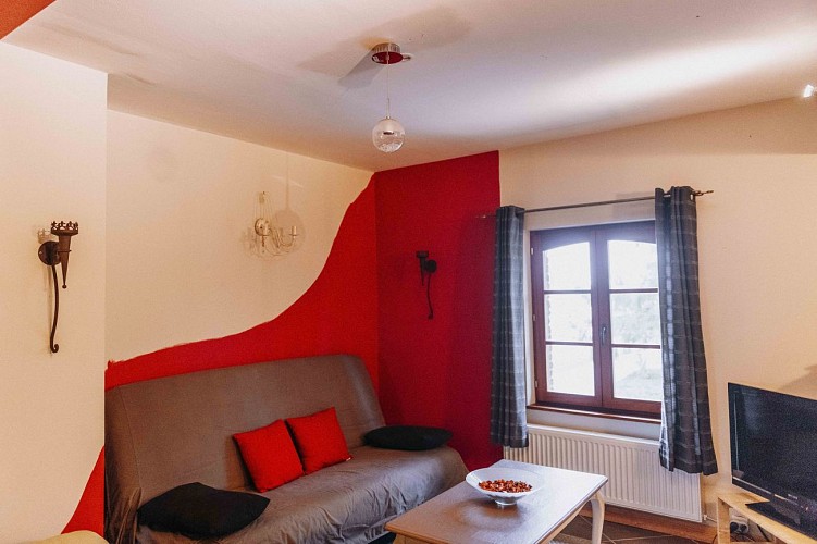 Woonkamer van het vakantiehuis A la petite éolienne in Froidchapelle