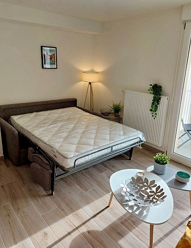 Canapé-lit déplié meublé - Rochel Céline