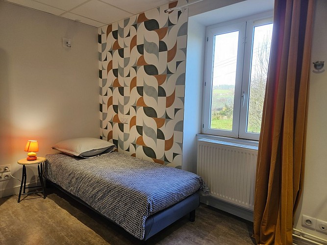 Chambre simple avec coin banquette