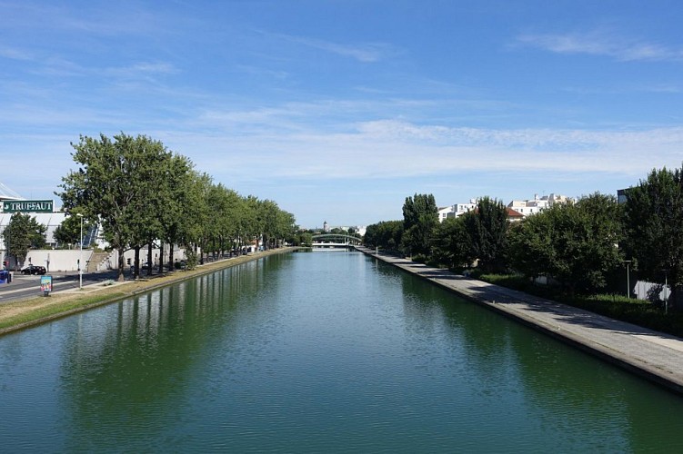 Return to the Parc de la Villette by the other river bank.