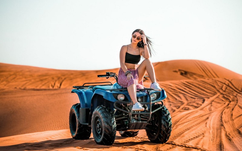 Premium Morning Quad Bike, Sandboarding and Camel Ride